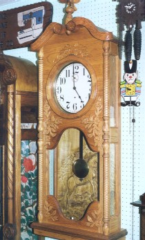 Hand-carved wooden clocks: some of the hundreds on display for enjoyment, not for sale.