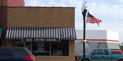 A flag in the window for Charlie Company, Sauk Centre, Minnesota