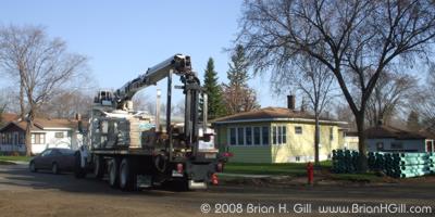 Setting up for the day's work on Ash Street, Sauk Centre, Minnesota.