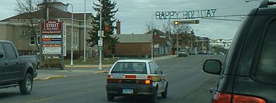 "Happy Holiday" over Main.