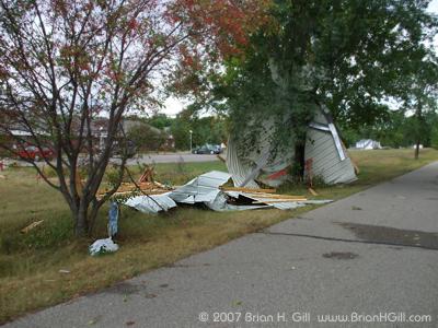 Looks like part of a shed, but most likely started as part of a roof. Sauk Centre, Minnesota