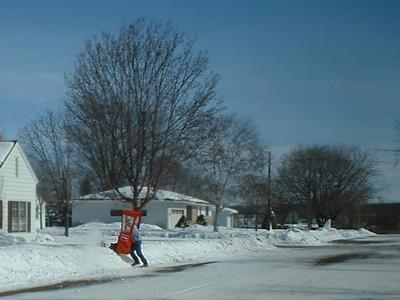 Shirtsleeve snowblowing in Sauk Centre